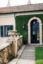 Arched glass door of Villa Balbianello with creeping figs. Italy Royalty Free Stock Photo