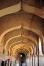 Arched hallway in the Hampi temple complex. Cultural heritage, ancient architecture of India