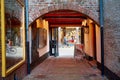 Arched historic cobblestone tunnel pathway in an alley