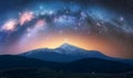 Arched Milky Way over the beautiful mountains at starry night Royalty Free Stock Photo