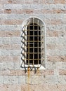 Arched old window in a stone wall Royalty Free Stock Photo