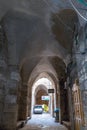 Arched passage under the houses on Derech Shaar HaArayot street inside the old city of Jerusalem leading from the Lion Gate in Isr