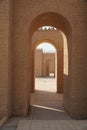 Arched path surrounded by stony walls in Babylon