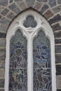 Arched stained glass church window Royalty Free Stock Photo