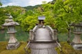 The arched stone bridge over the garden pond inside Eikan-Do temple. Kyoto Japan