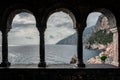 Arched stone window or opening in a stone wall overlooking scenic landscape of ligurian sea and mountains in Portovenere, Italy Royalty Free Stock Photo