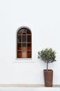 Arched Stained Glass Window on White Wall Royalty Free Stock Photo