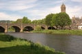 arched bridge over river Tweed and church tower at Peebles in summer