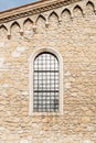 Arched window in the ancient stone wall Royalty Free Stock Photo