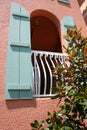 Arched window with blue shutters Royalty Free Stock Photo