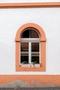 An arched window in a tenement house