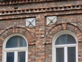 Arched windows of brick building