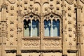 Arched windows and decorative wall detail on the front of the Jabalquinto Palace, Baeza, Spain. Royalty Free Stock Photo