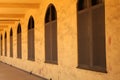 Arched windows in a long hallway