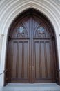 Arched wooden church door