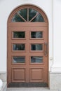 Arched wooden door with glass