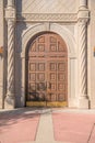 Arched wooden double door with decorative stone doorframe at downtown Tucson, Arizona Royalty Free Stock Photo