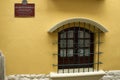 Arched wooden window with metal grating. La Paz, Bolivia