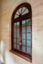 Arched wooden window of Thibaw Palace  Thiba Palace  in Ratnagiri, Royalty Free Stock Photo