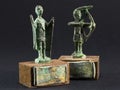 archer bronze statuette and chieftain praying with cloak and stick fgurine Royalty Free Stock Photo