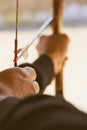 Archer holds his bow aiming at a target Royalty Free Stock Photo