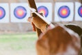 Archer holds his bow aiming at a target Royalty Free Stock Photo