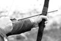 Archer holds his bow, black and white photo Royalty Free Stock Photo