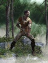 Archer man with bow and arrow in the woods Royalty Free Stock Photo