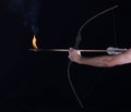 archer shoots a flaming arrow from bow Royalty Free Stock Photo