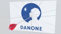 Archery arrow breaks glass plate with DANONE company logo. Business issue conceptual editorial 3D rendering