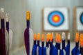 Archery arrows with targets in out of focus background Royalty Free Stock Photo