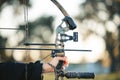 Archery bow closeup and woman hands at shooting range for competition, game or learning in field or outdoor sports Royalty Free Stock Photo