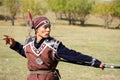 Almaty / Kazakhstan - 09.23.2020 : A teenager in national dress learns to shoot a bow