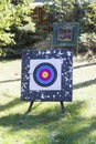 Used target for archery with an arrow in a bullseye on the train