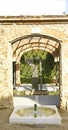 Arches and columns with fountain and pond in El Clot park, Barcelona