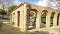 Arches and columns with fountain and pond in El Clot park, Barcelona