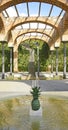 Arches and columns with fountain and pond in El Clot park, Barcelona