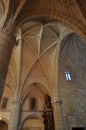 arches inside a cathedral with windows and columns