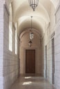 Arches and lobby of the cloister in a medieval monastery in Lyon, France, with its typical stone and marble architecture