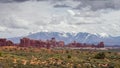 Arches panorama and snowcapped mountains in the background Royalty Free Stock Photo