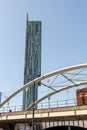 Arches of a tram bridge and Hilton Hotel Beetham Tower building in central Manchester. Royalty Free Stock Photo