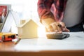 Architect Asian man drafting blueprint at table in office Royalty Free Stock Photo