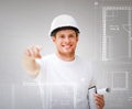 Architect with blueprint pointing at you Royalty Free Stock Photo