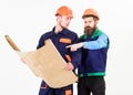 Architect and build concept. Men in helmets with blueprint Royalty Free Stock Photo