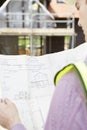 Architect On Building Site Looking At Plans For House Royalty Free Stock Photo