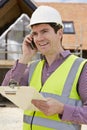 Architect On Building Site Using Mobile Phone Royalty Free Stock Photo