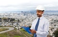 Architect or businessman in helmet with clipboard Royalty Free Stock Photo