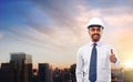 Architect or businessman in helmet shows thumbs up Royalty Free Stock Photo