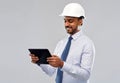 Architect or businessman in helmet with tablet pc Royalty Free Stock Photo