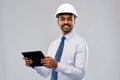 Architect or businessman in helmet with tablet pc Royalty Free Stock Photo